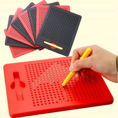 Red pegboard with holes and a hand holding a yellow tool on a beige background
