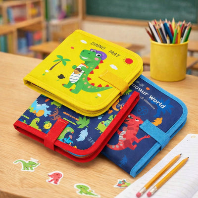 Three colorful children's books with dinosaur illustrations on a wooden table.