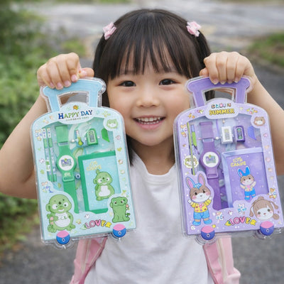 Child holding two toy packaging boxes with cartoon characters outdoors.