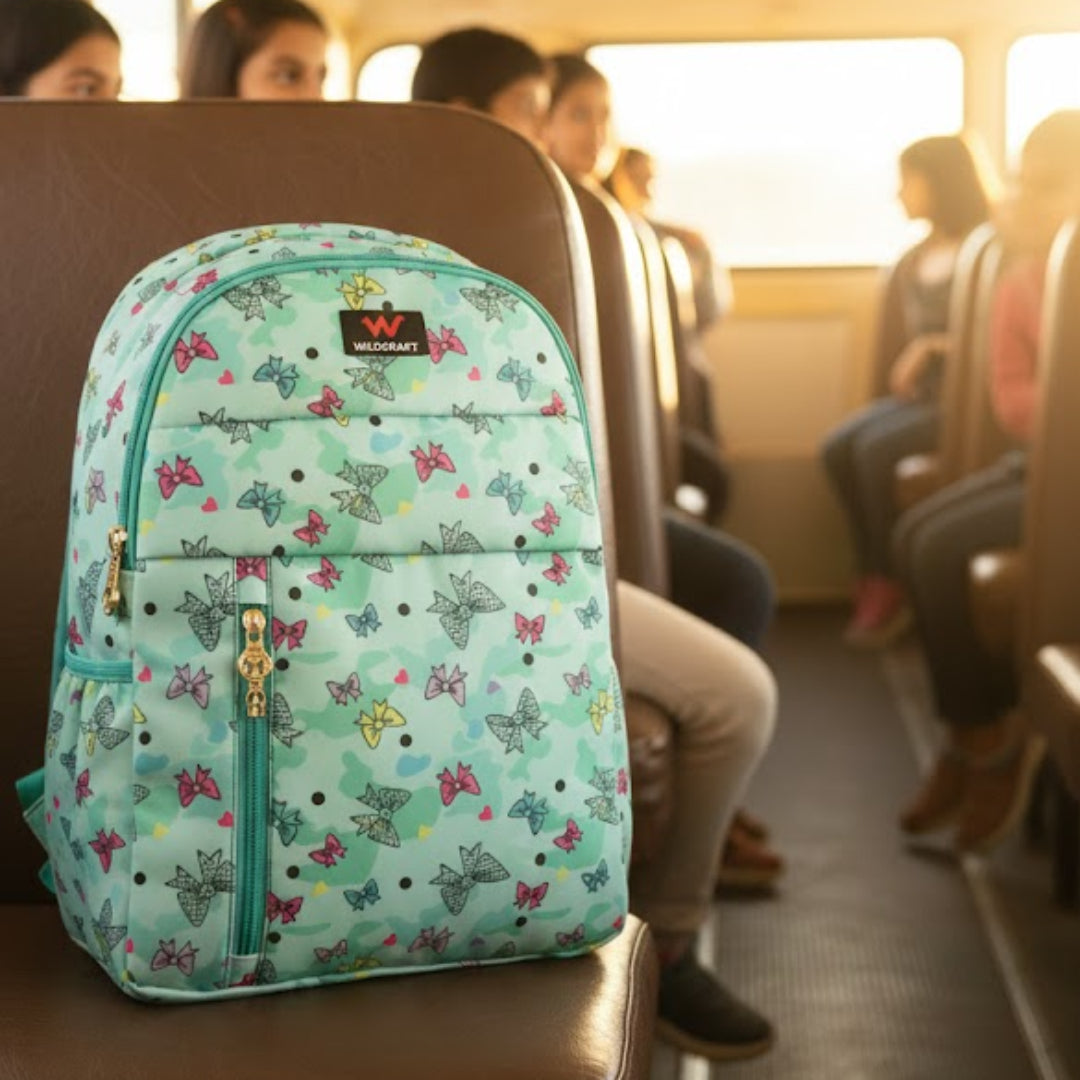 Backpack with butterfly pattern on a school bus seat