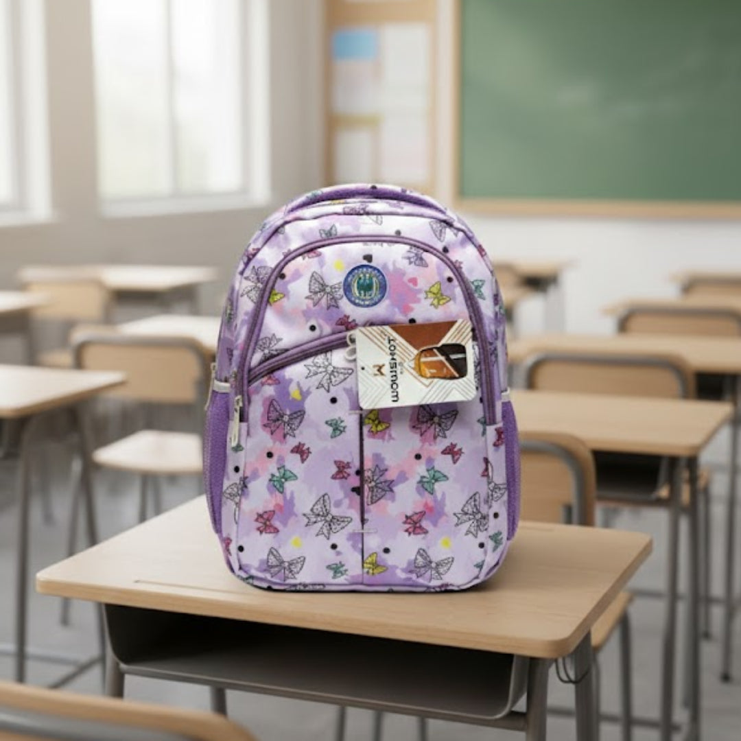 Floral-patterned backpack on a desk in a classroom setting