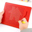 Red dot matrix board with hands holding a yellow marker