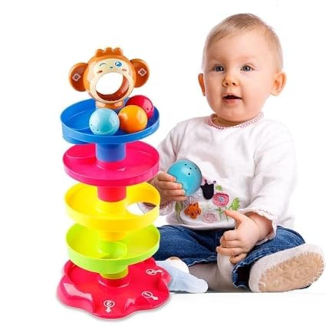 Child playing with a colorful toy stacker