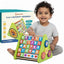 Child playing with a colorful 5-in-1 activity triangle toy by Shumee.