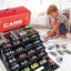 Child playing with toy cars and a large toy car set on a table.