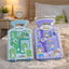Two toy packages with measurements and cartoon characters on a bed.