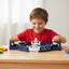 Child playing with a toy set on a table