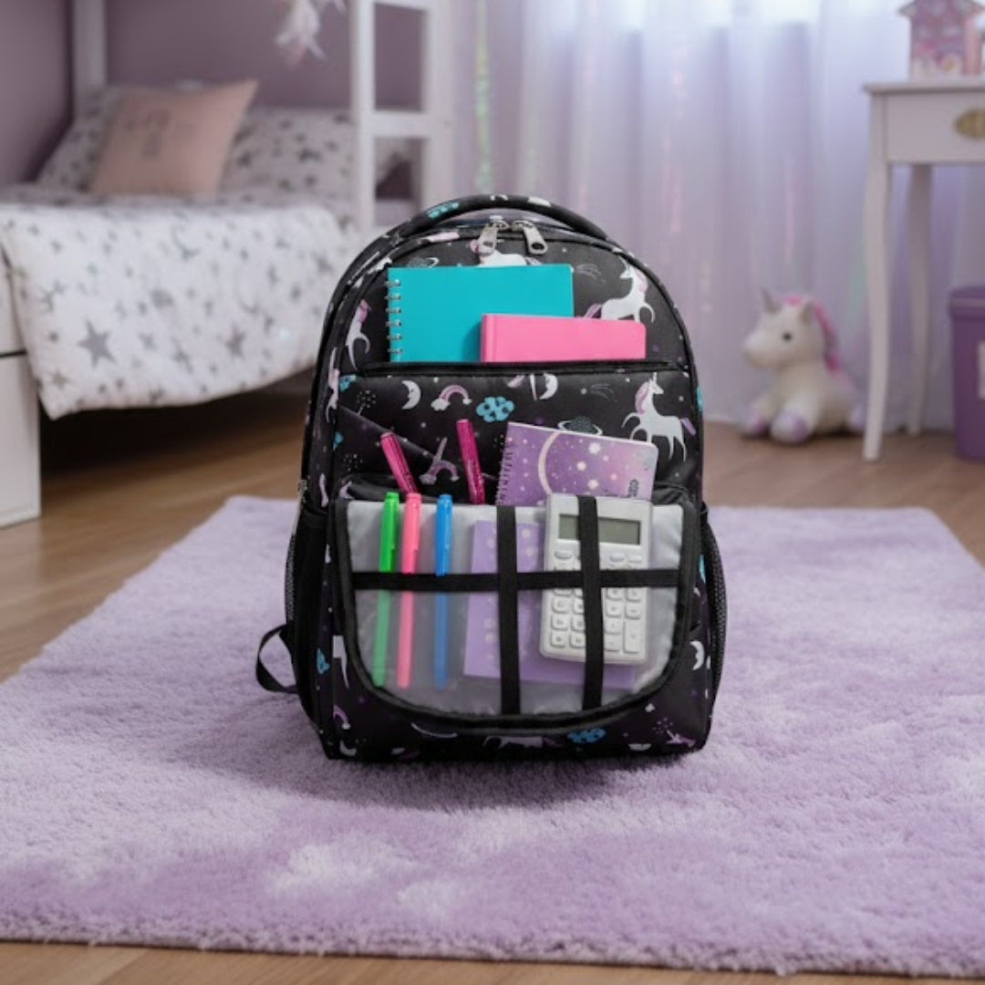 Backpack with stationery items on a rug in a bedroom with a bed and decor.